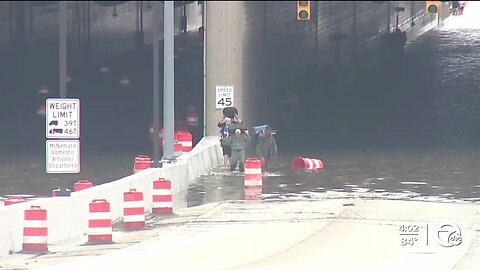 DTW flooding - footage of people walking in floodwater