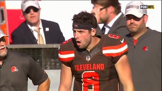 Players stand behind their coaching staff