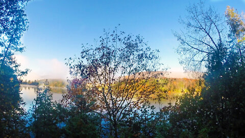 Misty Quebec lake October sunrise - timelapse