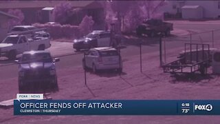 Officer fends off attacker