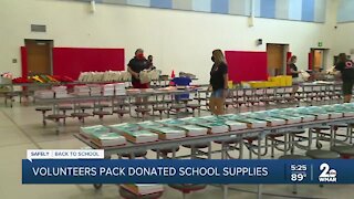 Volunteers pack donated school supplies at Lansdowne Elementary School