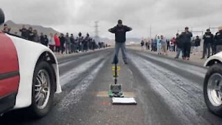 Drag race ends up with spectators pushing cars