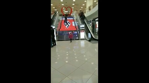 Staircase in Ukraine mall decorated with giant Swastika