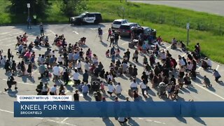 Brookfield protesters kneel for nine