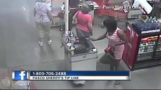 Surveillance video shows crooks dressed in drag push clerk, steal gift cards