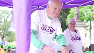 Volunteers help raise awareness and funds for Alzheimer's Disease.
