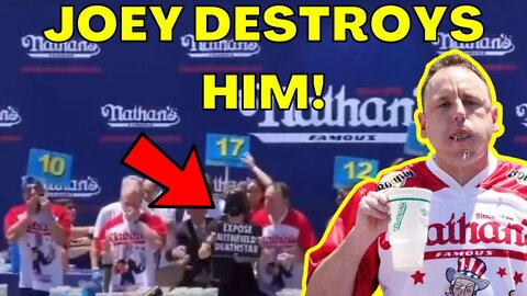 Joey Chestnut DESTROYS ANIMAL RIGHTS PROTESTER at Nathan's Hot Dog Contest! STILL CHAMP!