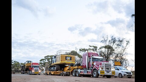 Mack Titan with lowboy low loader hauling an oversize load Cat 390FL excavator, Western Australia.