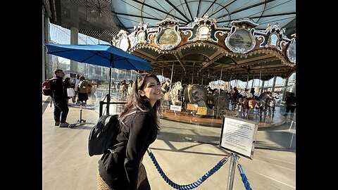 Taking a ride on Jane’s Carousel in Brooklyn.