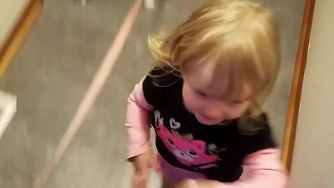 Excited toddler affectionately hugs everyone