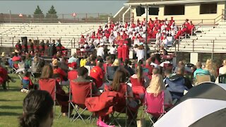 Graduates walk stages in outdoor ceremonies across Milwaukee-area counties