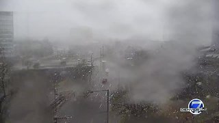 Snow falls in downtown Denver as storm moves through Colorado