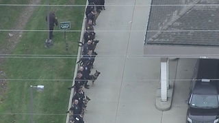 Police officers line up as they bring out WSU Police Officer Collin Rose