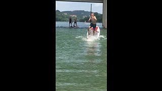 Excited dog causes epic paddleboarding fail