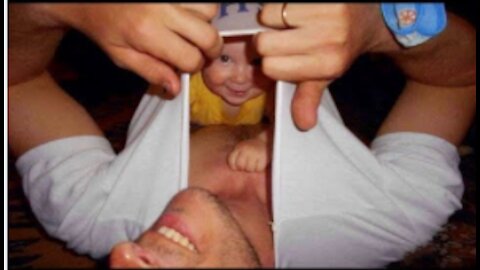 funny baby with dad playing and fighting