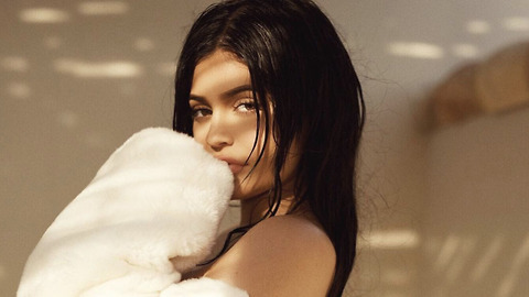 Kylie Jenner Uses a BABY to Hide Her Own Bump!