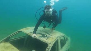 Buddies carry out underwater exploration of old quarry