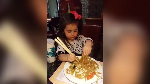 Tot Girl Struggles To Eat Noodles With Chopsticks