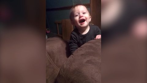 Little Boy Bangs Head On The Couch