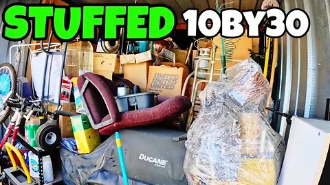 STUFFED 10 by 30 we paid $3000 for abandoned storage unit