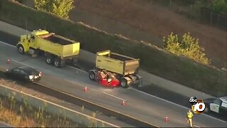 Driver wedged under semi on I-8
