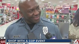 Officers & kids shop for presents at Shop with a Cop