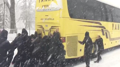 PUSH! Northeastern women's basketball team fixes stuck bus in snowstorm - ABC15 Digital