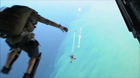 Pararescue Jumpers and U.S. Navy members Perform Water Jump