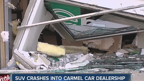 Car crashes into dealership in Carmel