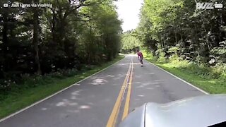 Skateboarder's spectacular road spill