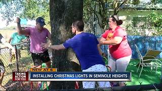 Installing Christmas lights in Seminole Heights