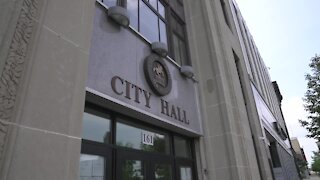 City hall will continue to operate in person.