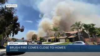 Large brush fire threatening homes in Oceanside