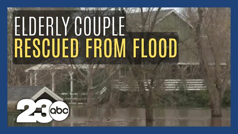 Elderly couple rescued from flooded home