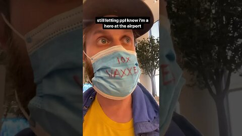 Super Vaxxed Hero wears mask at airport 3 yrs later