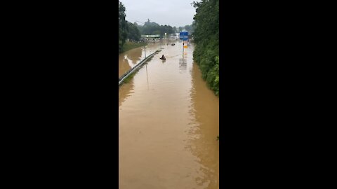 Flood guy rides jetski