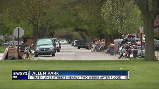 Trash still lines streets two seeks after flooding