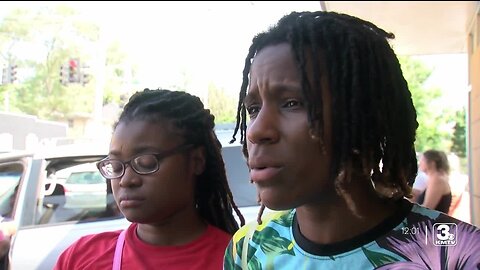 Demonstrators have questions after Omaha Police arrest man in connection to death of child left in van