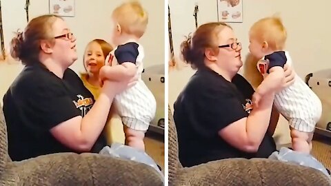 Baby on your mother's lap get a kiss and right after it ends in laughter