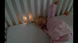 Cute baby girl refuses to get out of bed