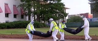 Protesters line up empty body bags in Florida