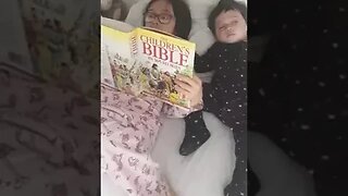 Big sister is reading the Bible to her baby brother and baby sister-cuteness overload