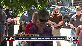 Community prayer gathering for wounded officer
