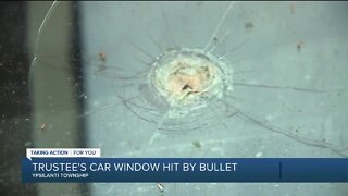 Ypsilanti trustee's car window hit by bullet