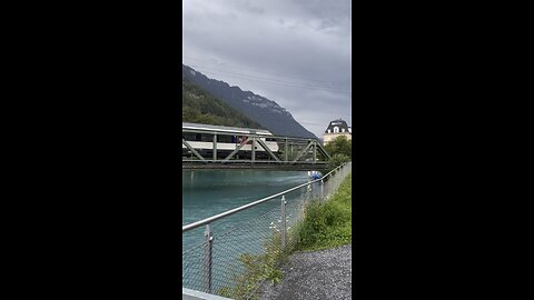 Grindlewald, Switzerland 🇨🇭 train crossing over the lake | beautiful view