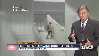 Kids seen throwing rocks at cars