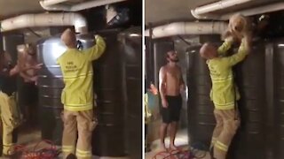 Firefighters rescue dog stuck between water tank and a wall