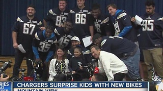 Chargers surprise kids with new bikes