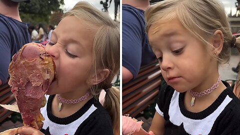 Hungry girl has a blast eating the giant Disney turkey leg