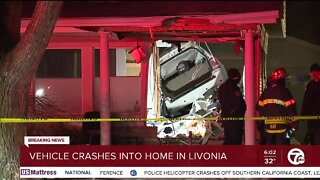 One injured after a car crashes into a home in Livonia, police say